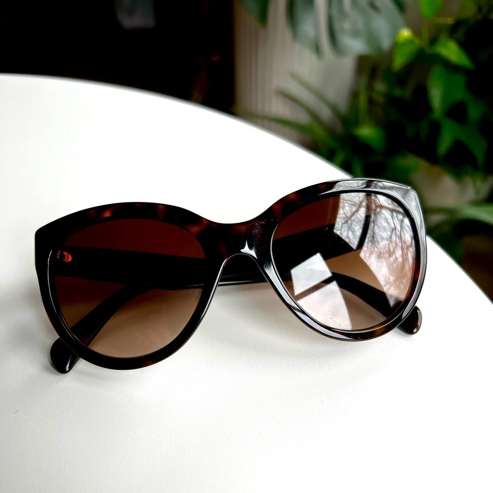 Prada cat eye tortoise with brown lense sunglasses.